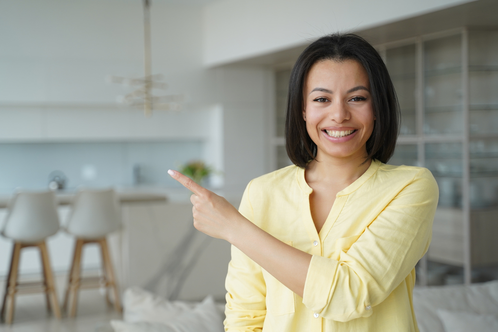 Woman pointing left