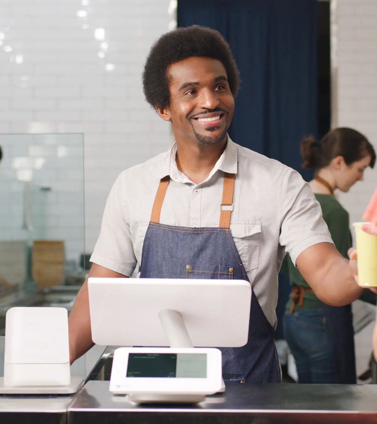 Man paying with credit card on Clover Mini