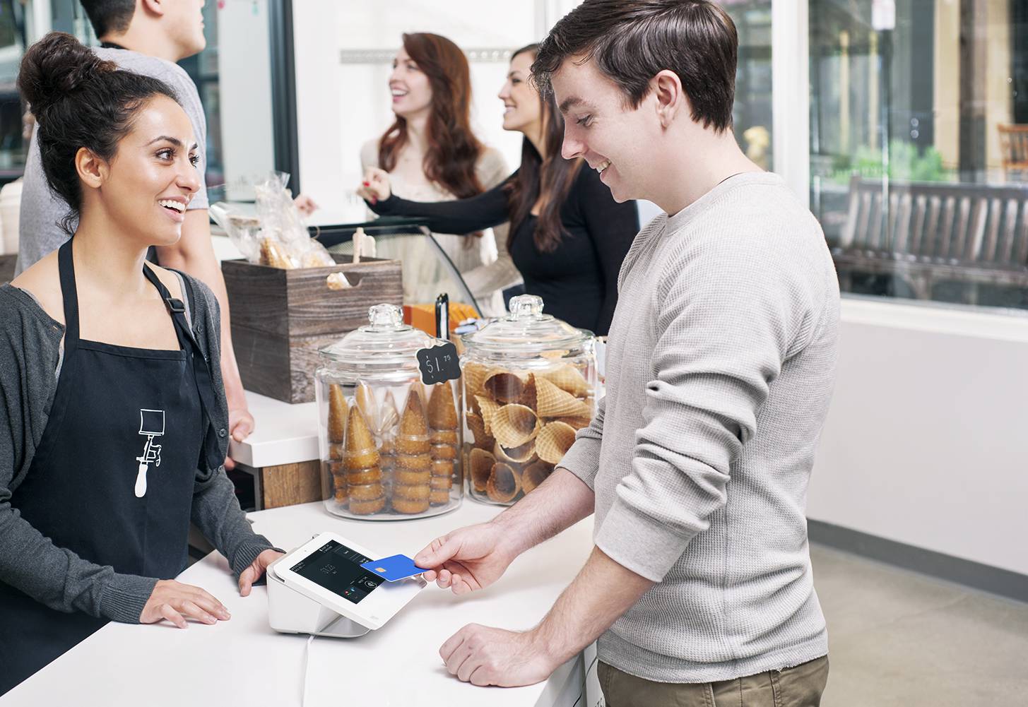 Man paying with credit card on Clover Mini